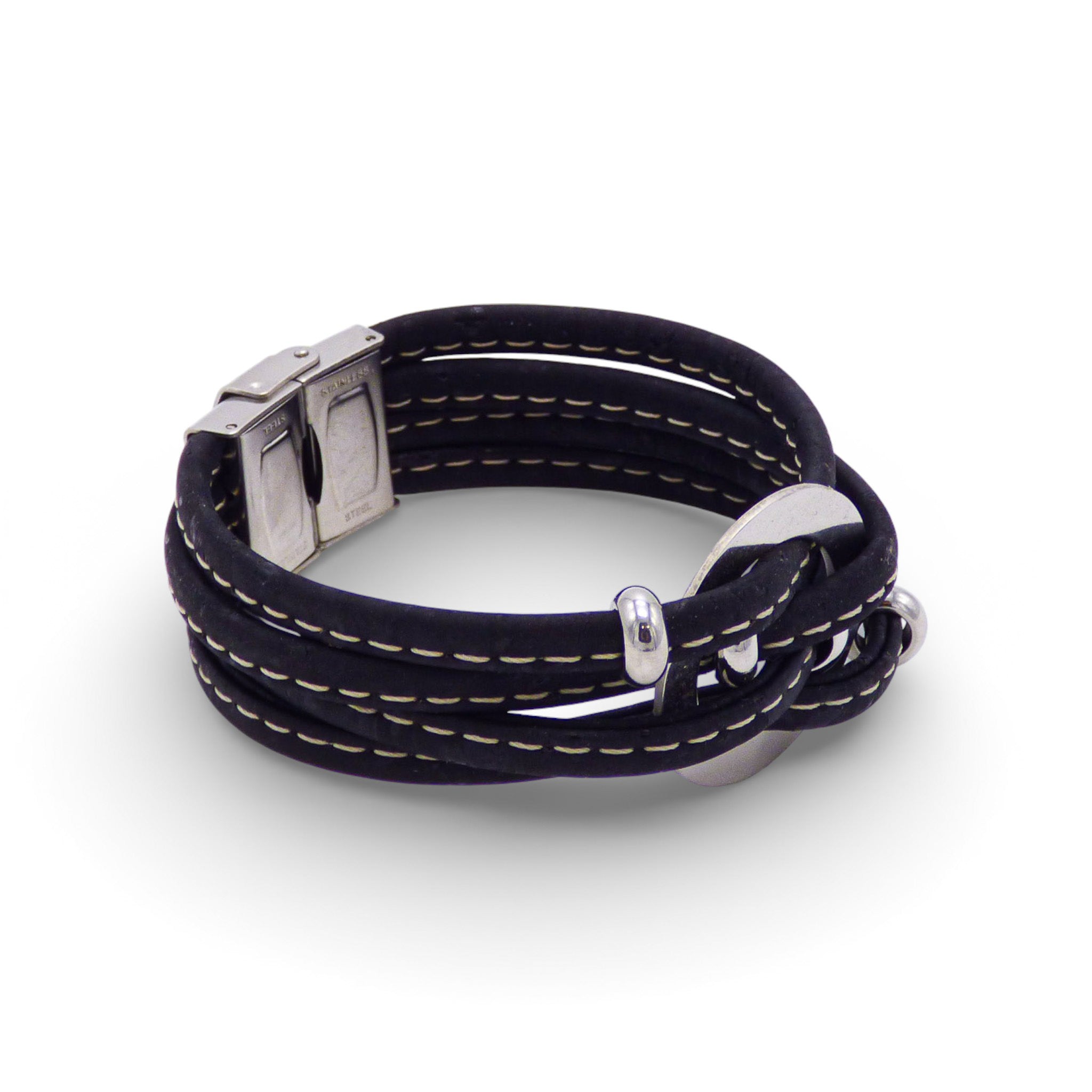 Multi-layered Cork Colors bracelet with central medallion, featuring a large silver clasp and black cork design.