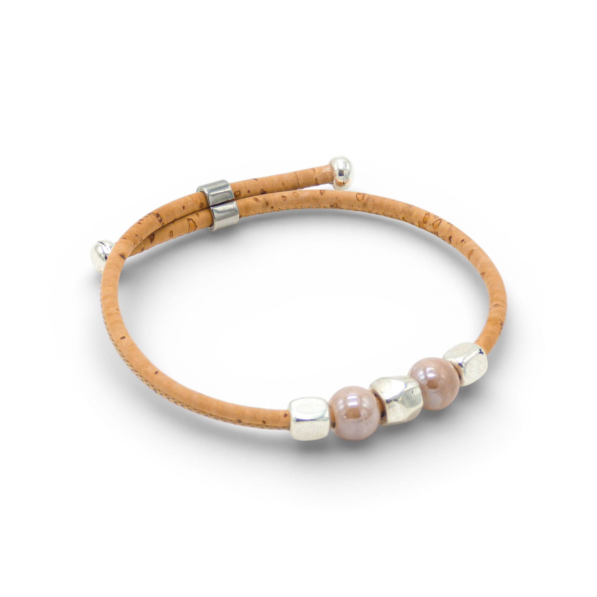 Delicate Cork Colors bracelet featuring a thin design with pale pink beads and a silver clasp.