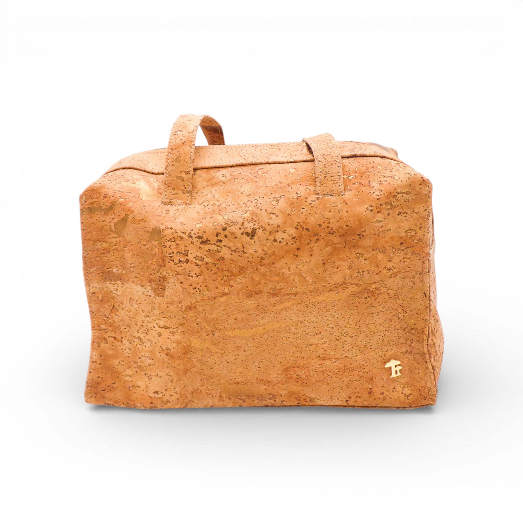Sac à main et épaule en liège de Cork Design, avec texture naturelle et design élégant, posé sur une surface neutre.