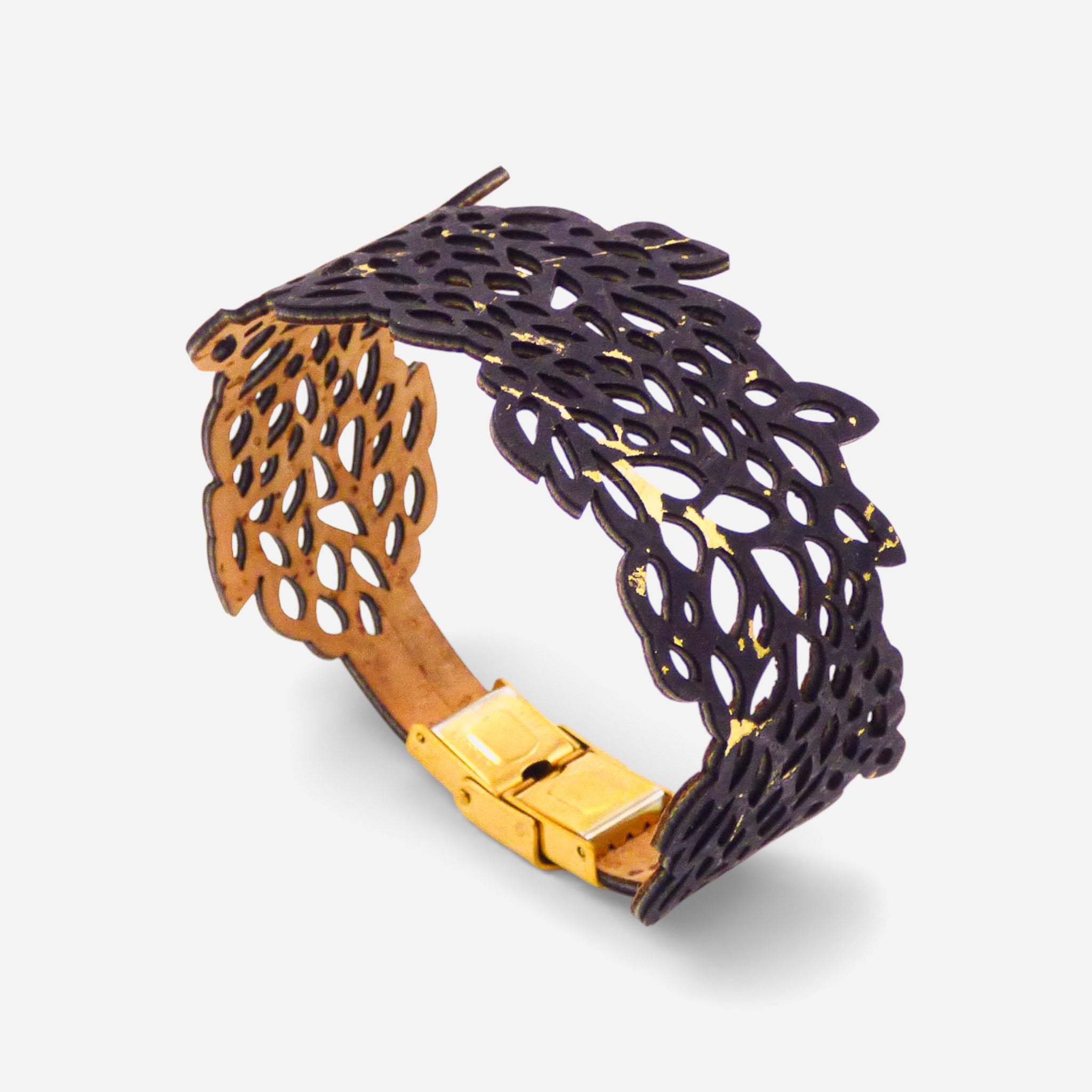 Black and gold leaf-patterned cork bracelet for women by Cork Colors, showcasing intricate cut-out design.