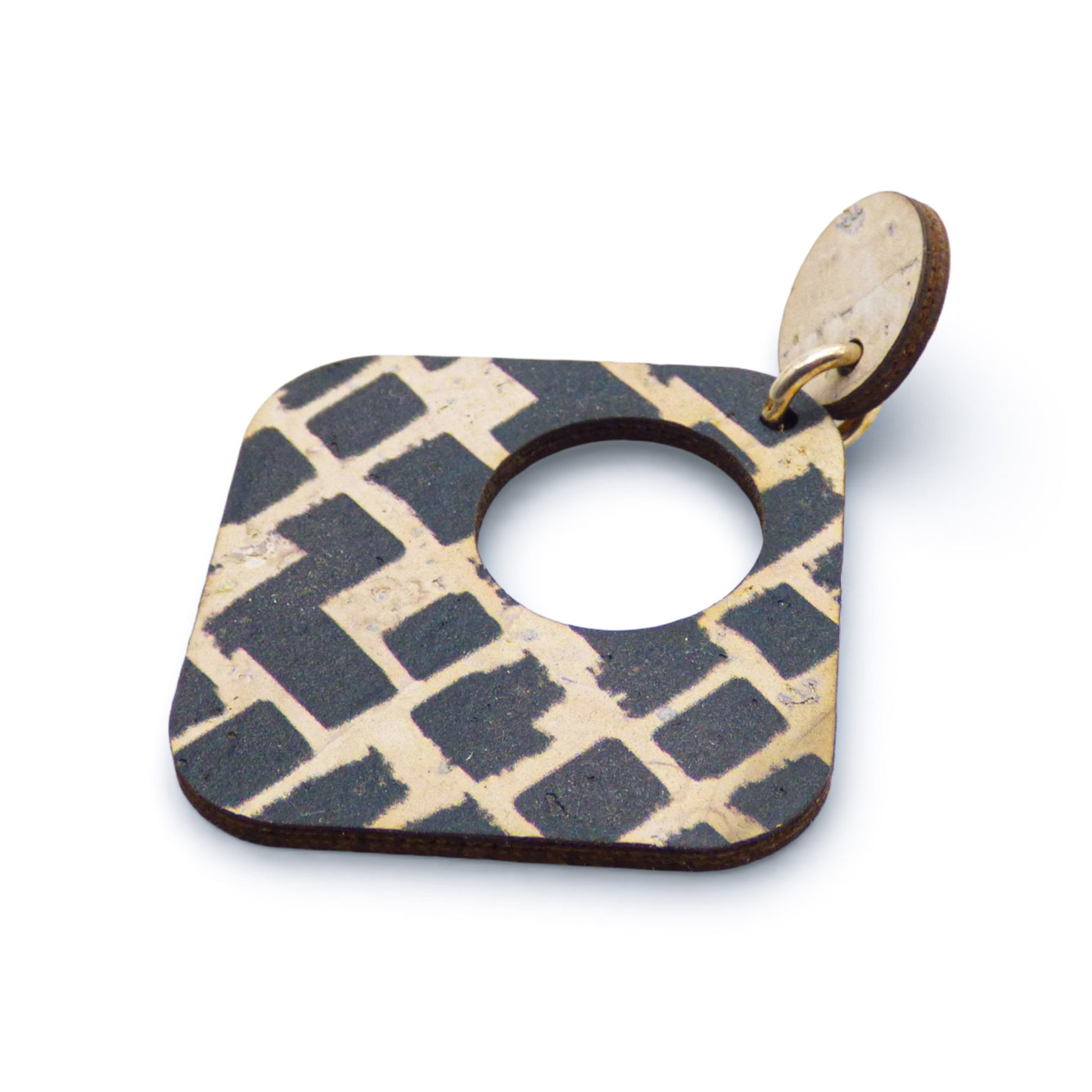 Geometric black and white cork earrings in a diamond shape by Artipel, showcasing unique texture and design.