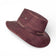 Chapeau cowboy en liège teinté bordeaux vu de profil — Amador Varum, œillets et bandeau, Portugal