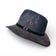 Chapeau Fedora en liège beige de la marque Amador Varum, avec un ruban élégant et une forme classique.