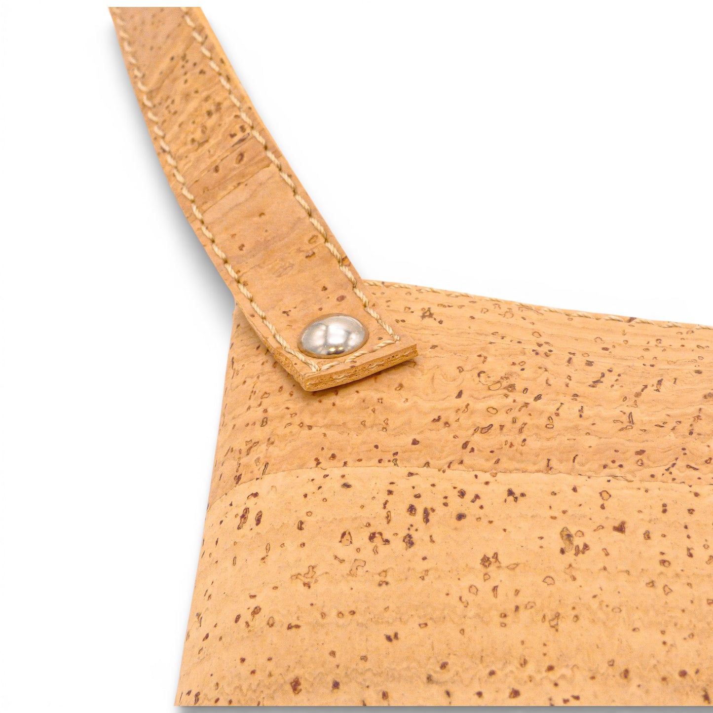 Natural cork pouch by Artipel featuring a metal rivet detail, showcasing its unique texture and design.