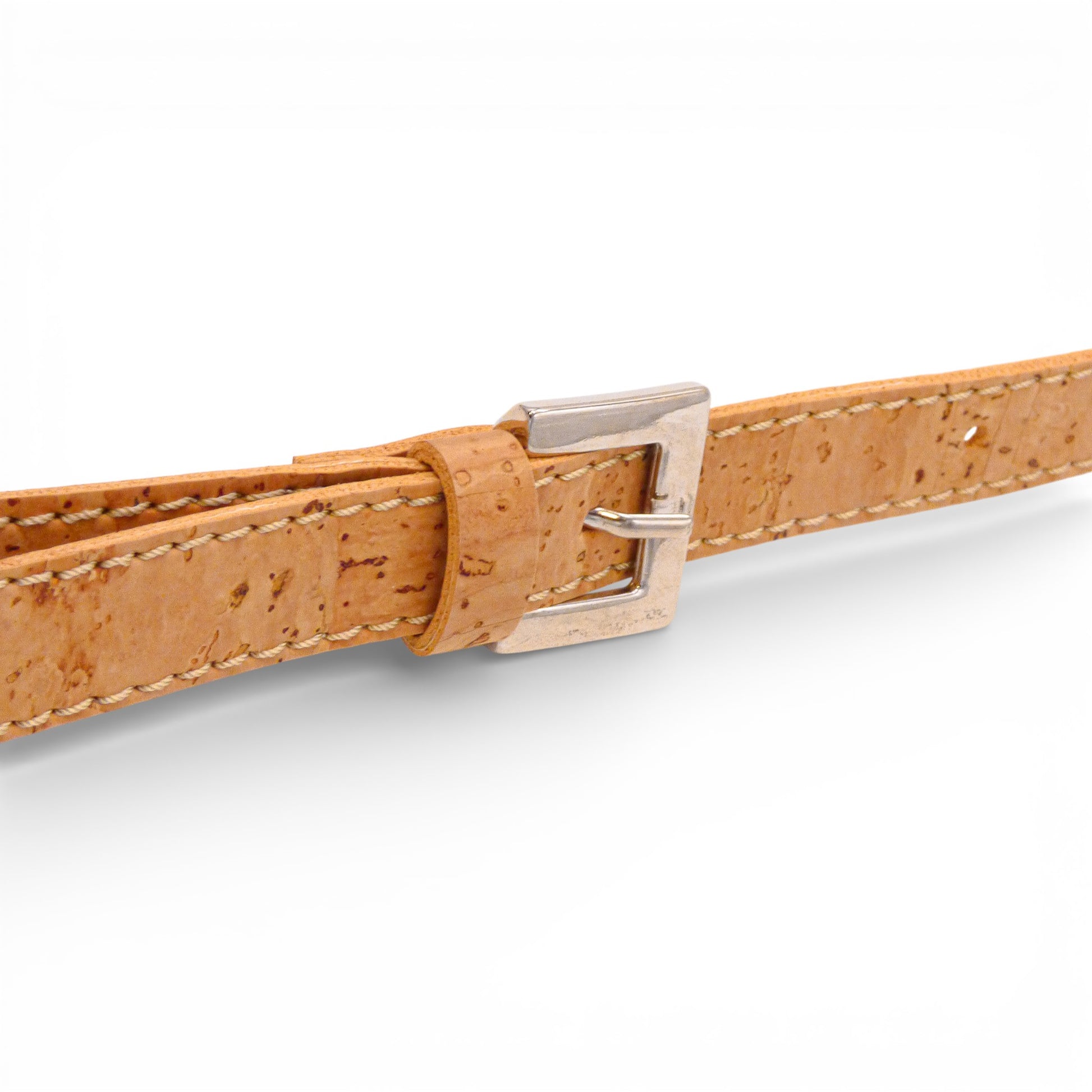 Detail view of Artipel natural cork pouch with fine buckle adjustment and strap.