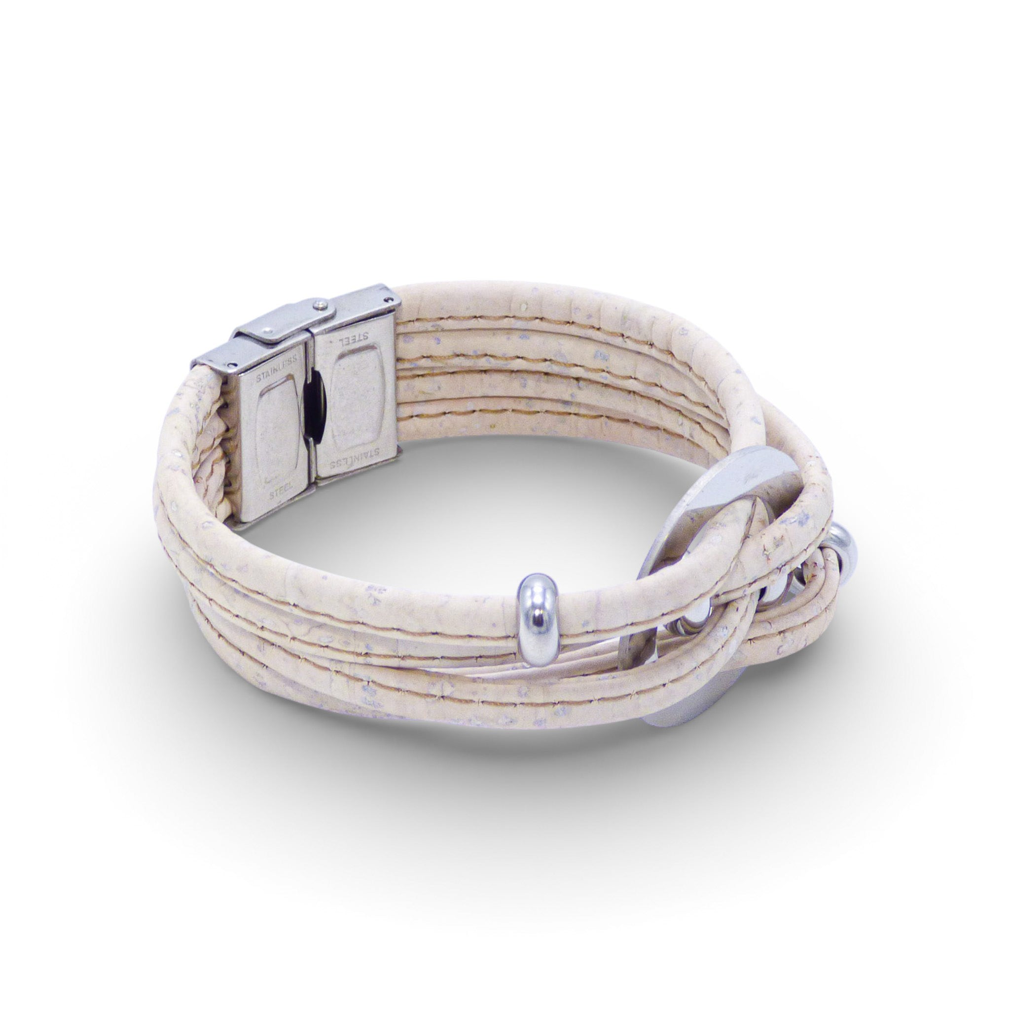 Multi-layered bracelet with central medallion from Cork Colors, showcasing a blend of cork textures and silver clasp.