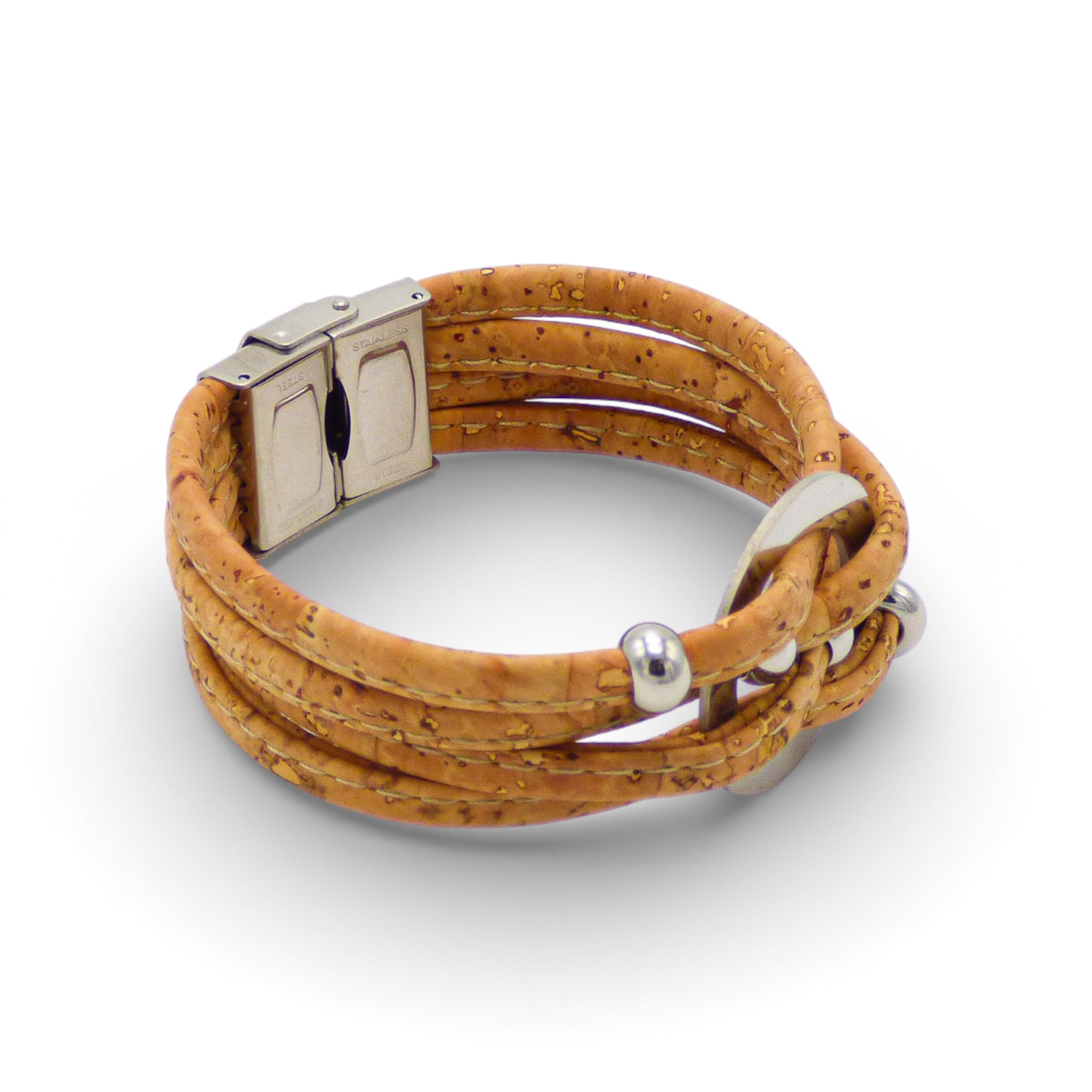 Multi-strand Cork Colors bracelet with a central medallion and silver clasp, showcasing earthy tones and stylish design.