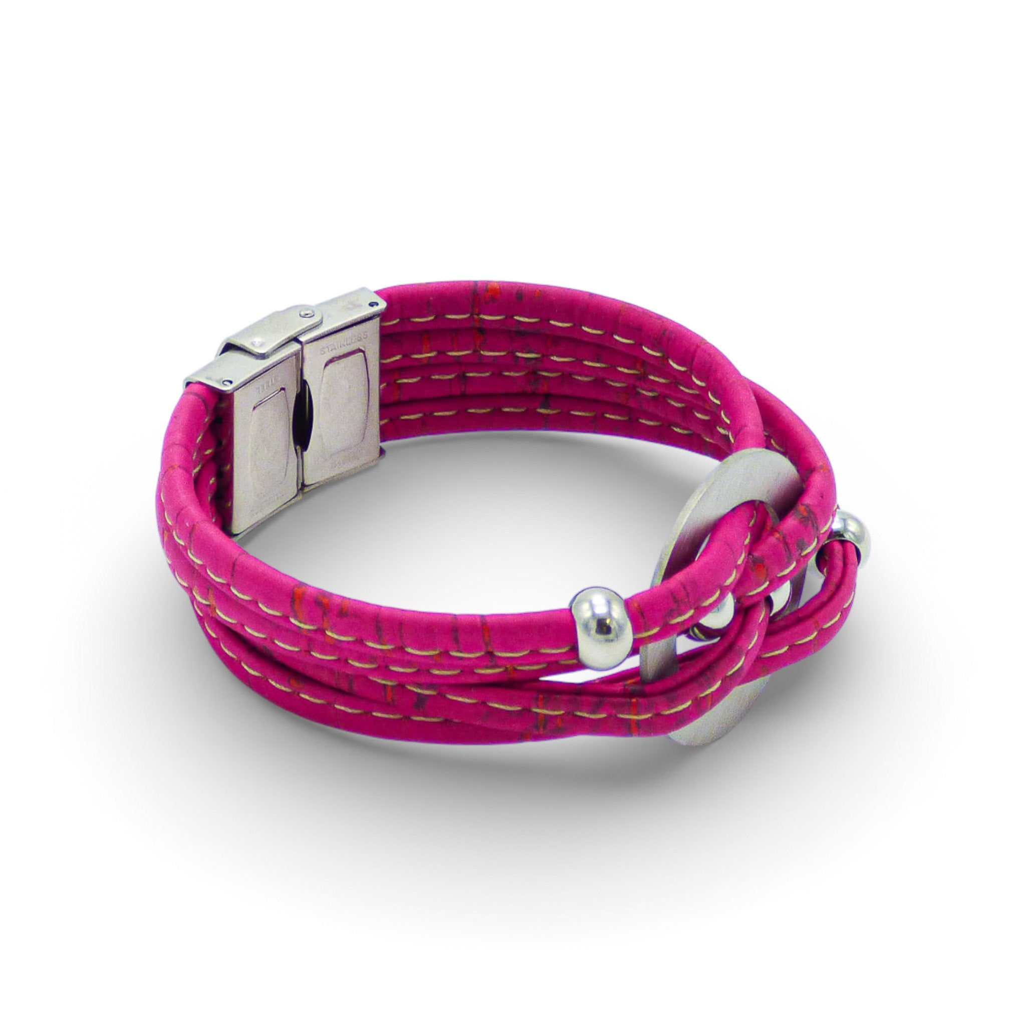 Multi-layered central medallion bracelet from Cork Colors in soft pink tones with a silver clasp.