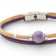 Gros plan sur la perle céramique violette du bracelet en liège — Cork Colors, rondelles argent, Portugal