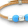 Delicate Cork Colors bracelet with a fine beaded design and silver clasp, featuring a blue cork finish.