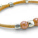 Delicate Cork Colors bracelet with light brown finish, pearl detailing, and silver clasp, showcasing a minimalist design.