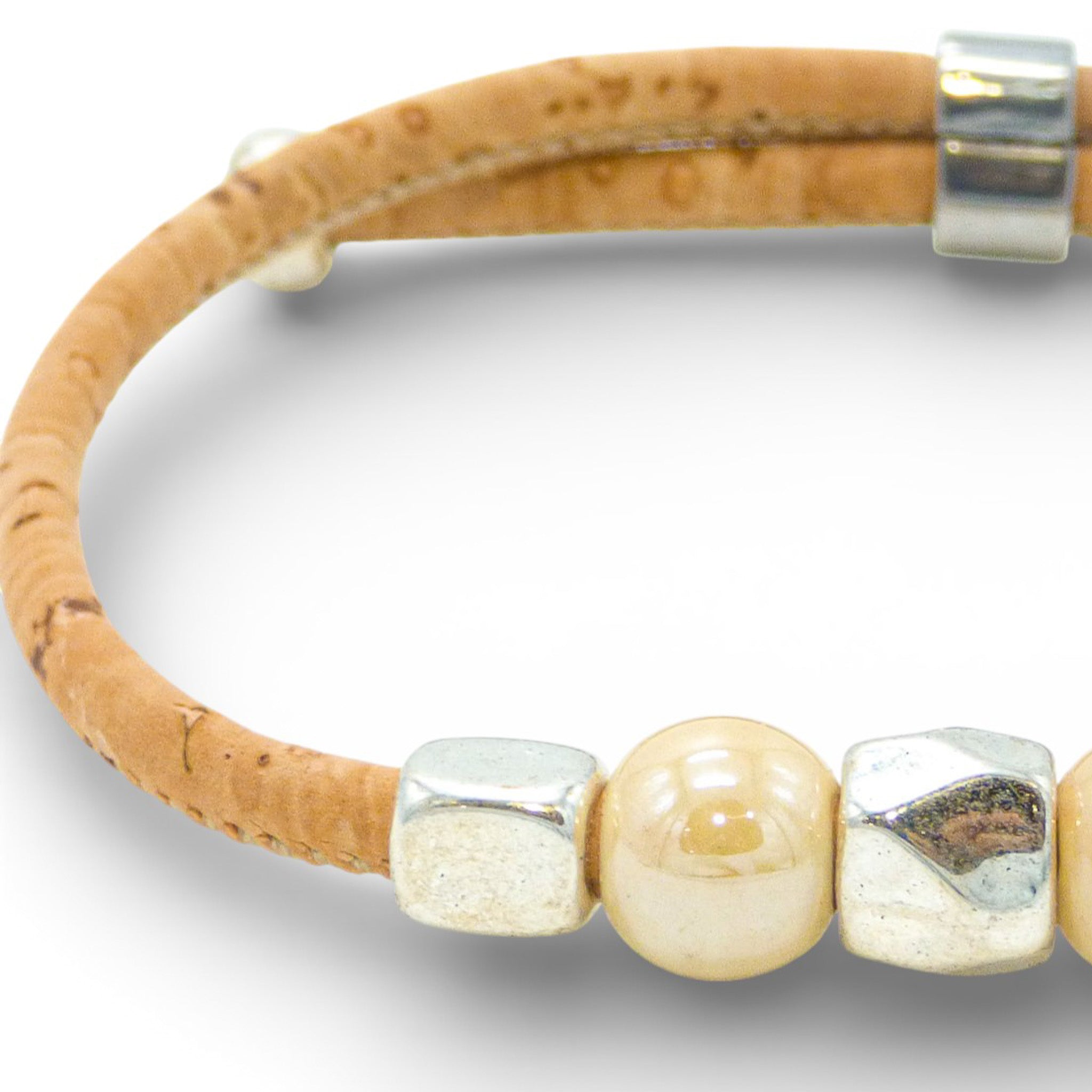 Delicate Cork Colors bracelet featuring a fin design with natural cork and silver bead clasp.