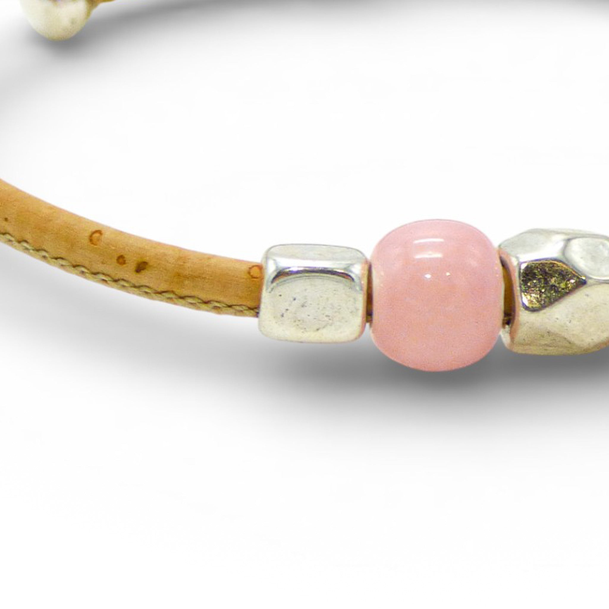 Delicate Cork Colors bracelet with pale pink pearls and silver clasp, showcasing a thin, elegant design.