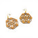 Boucles d'oreilles rosace en liège doré — Artipel, paire à plat trois-quarts, Portugal