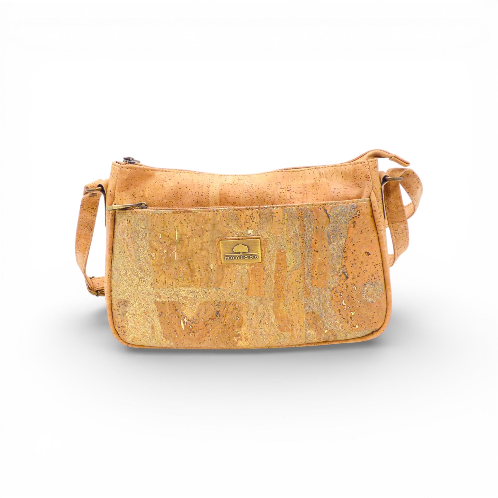 Sac bandoulière Montado in natural cork, featuring a sleek design with an adjustable strap and stylish hardware details.