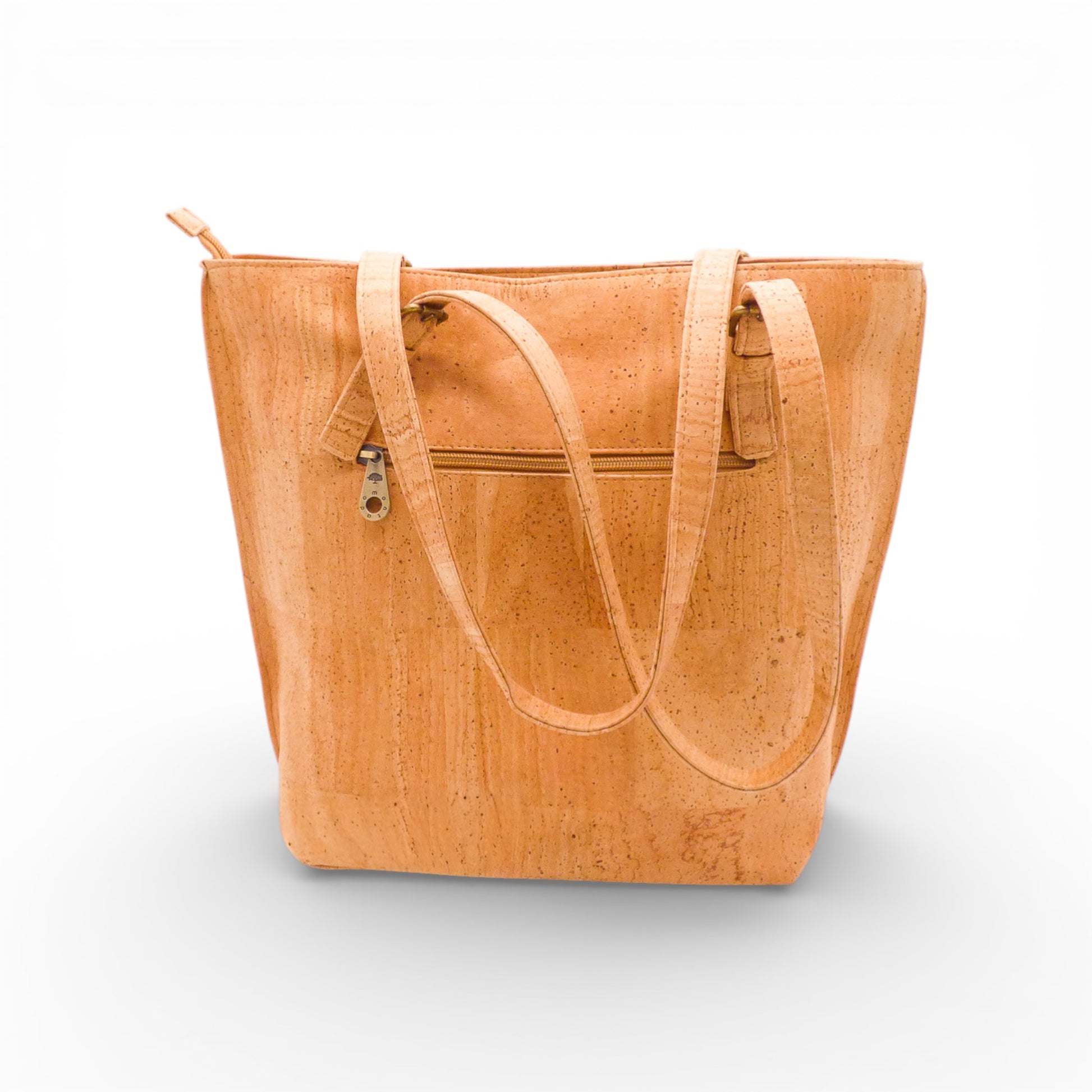 Sac épaule Montado en liège, avec design élégant et bandoulière ajustable, posé sur une surface neutre.