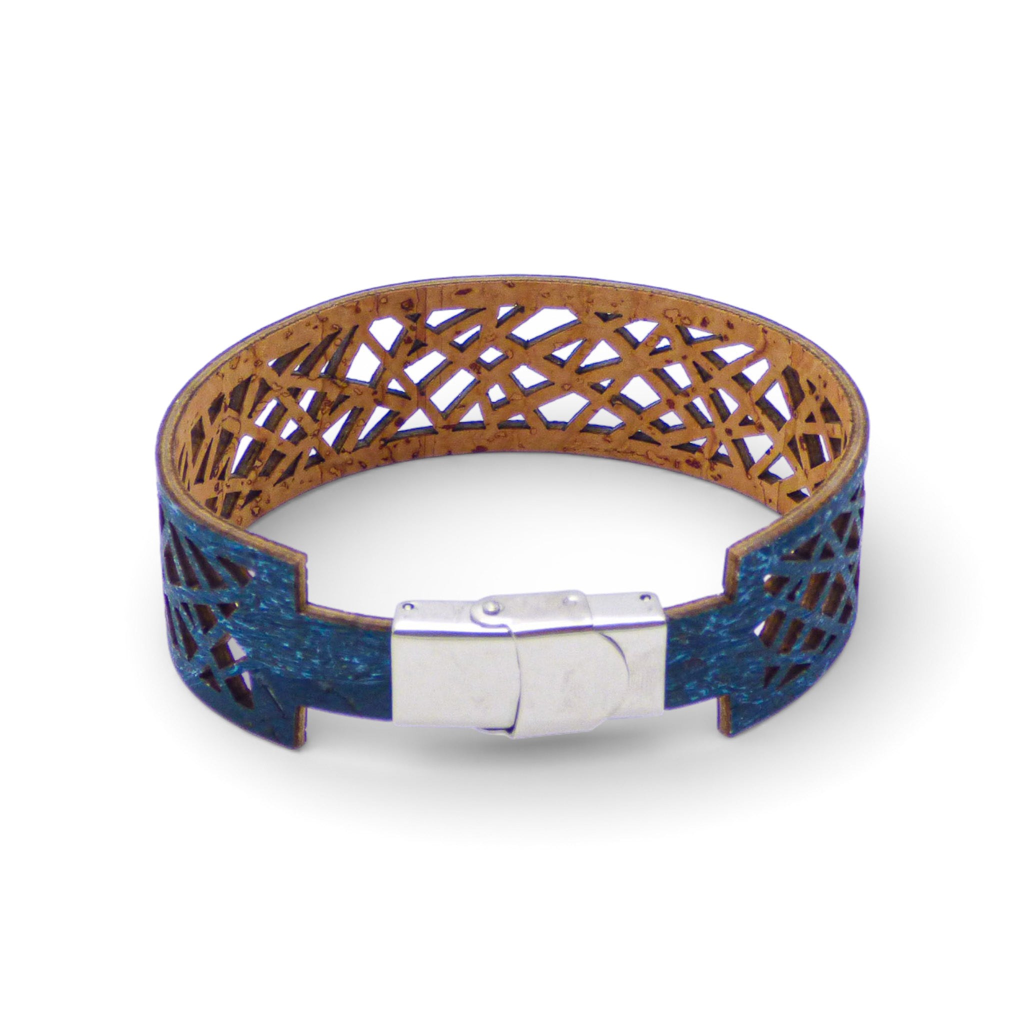 Geometric cuff bracelet in blue-green cork by Cork Colors, showcasing an intricate cut-out design.