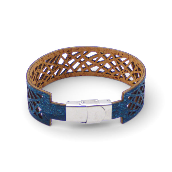 Geometric cuff bracelet in blue-green cork by Cork Colors, showcasing an intricate cut-out design.