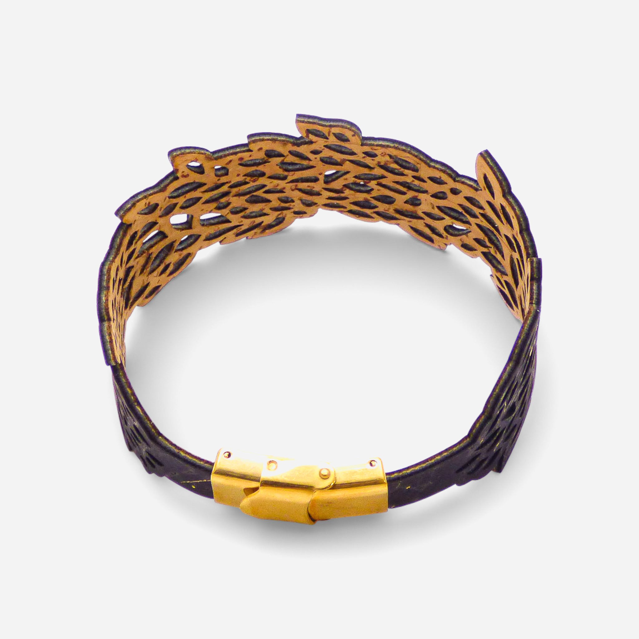 Black and gold lace leaf design on a women's cork bracelet by Cork Colors, showcasing intricate cut-out details.