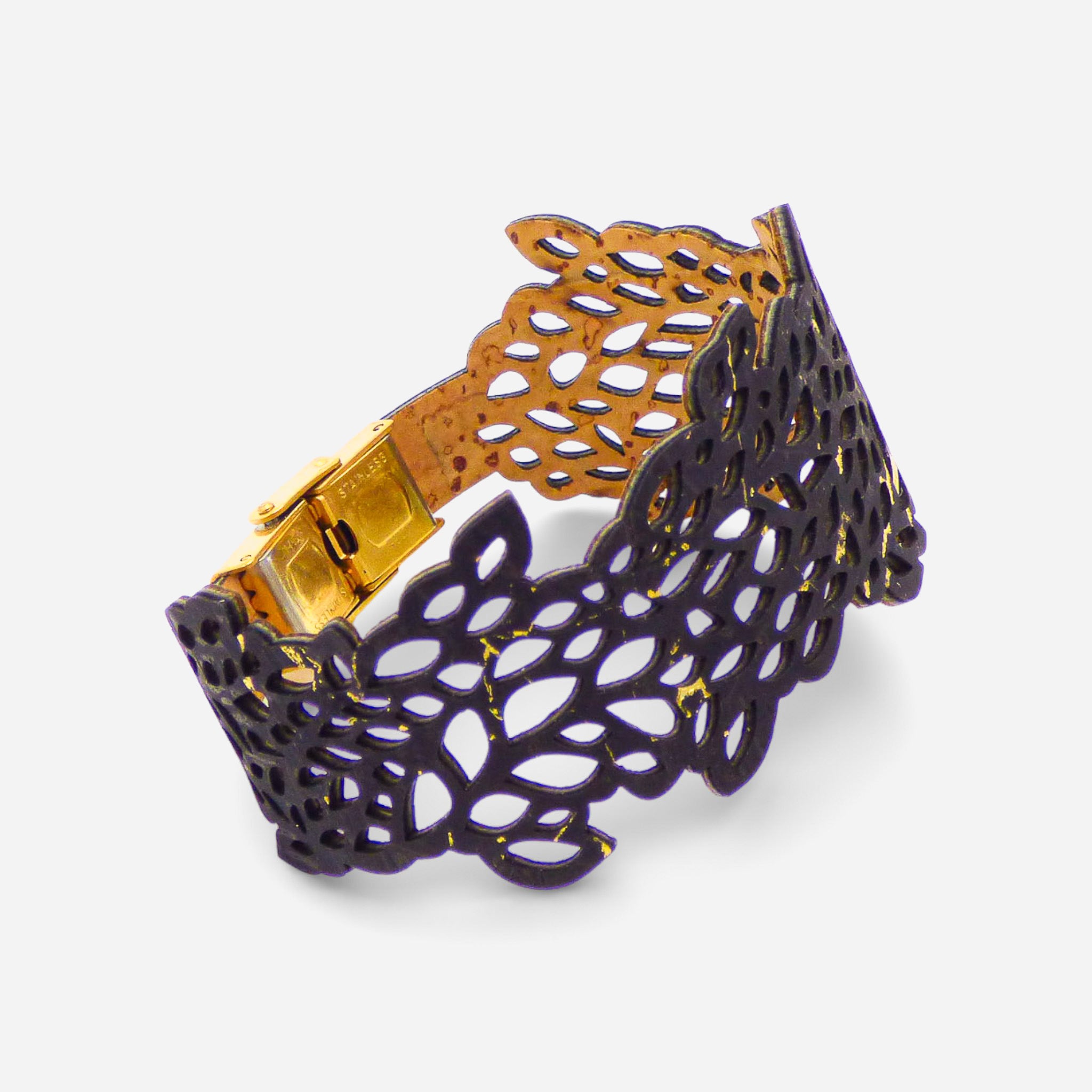Black and gold lace leaf design women's cork bracelet by Cork Colors, showcasing intricate cut-out patterns.