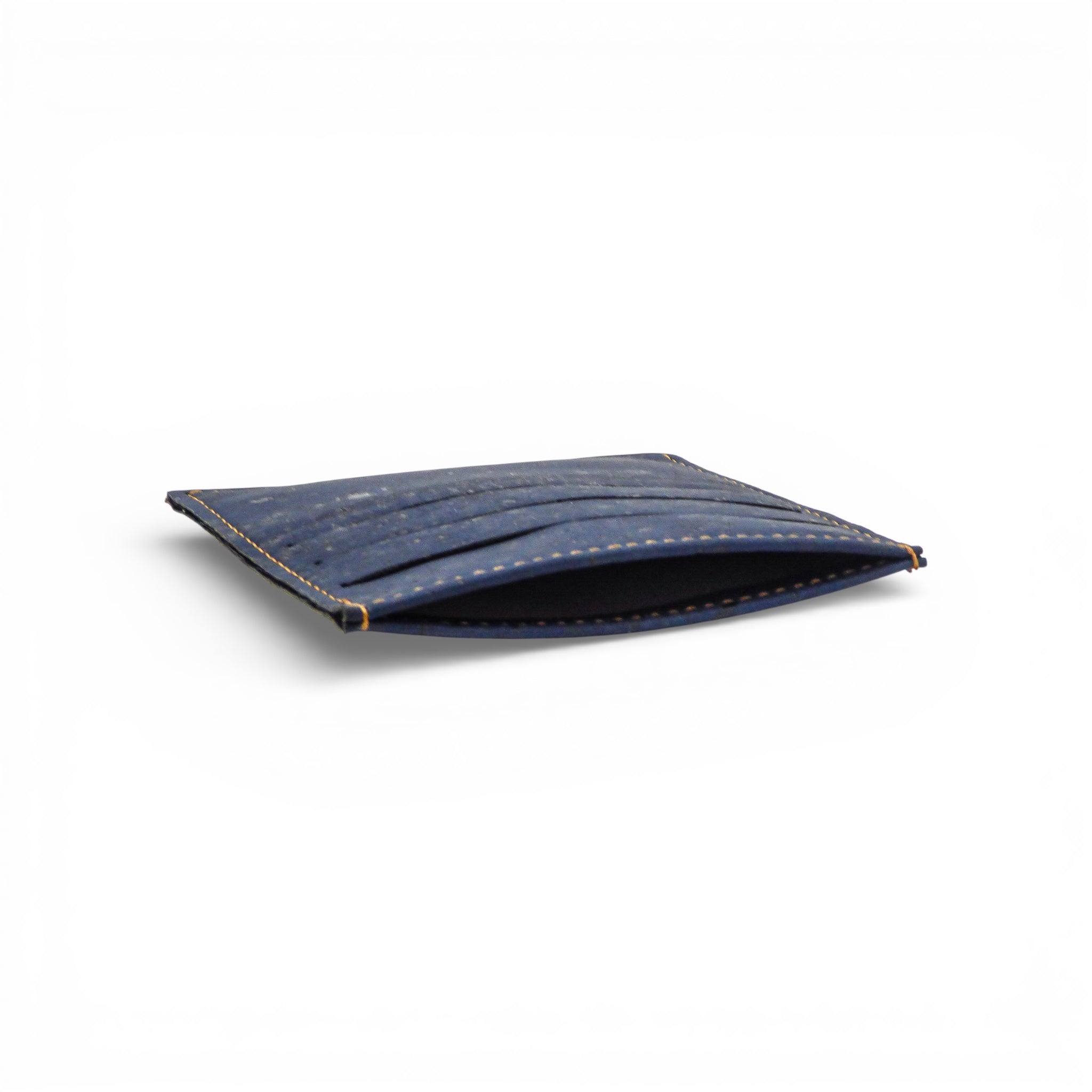 Ultra-slim Amador Varum porte-cartes with six slots, in natural blue cork, designed for discreet storage in pockets.