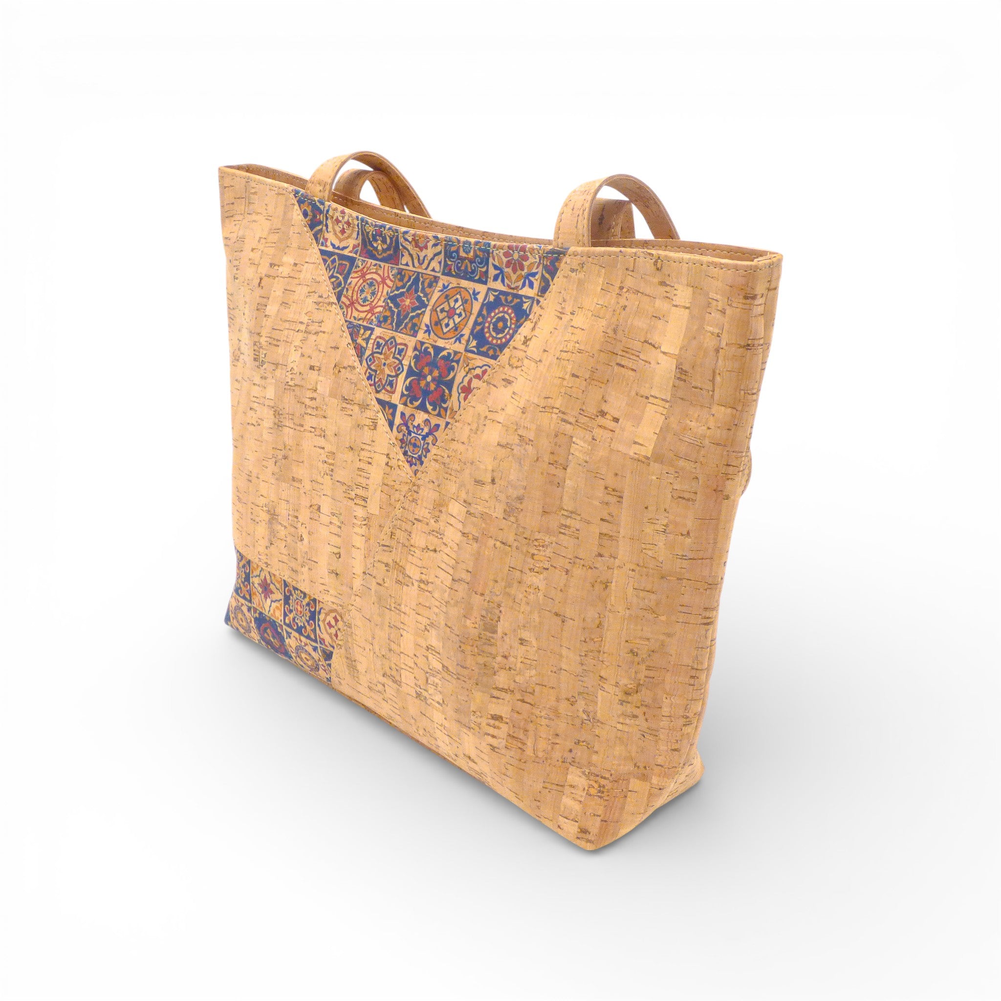 Sac à main en liège Azulejos de la marque Sobreiro, avec motif imprimé de carreaux de ciment, vu de côté.